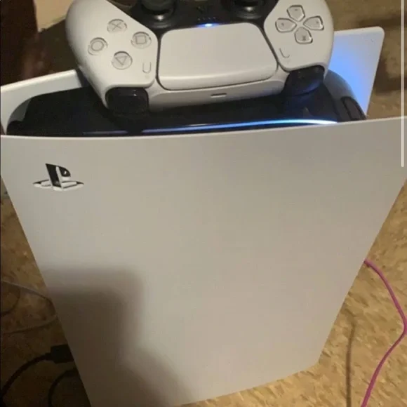 Its usedRed white controllerComes with all diffrent games